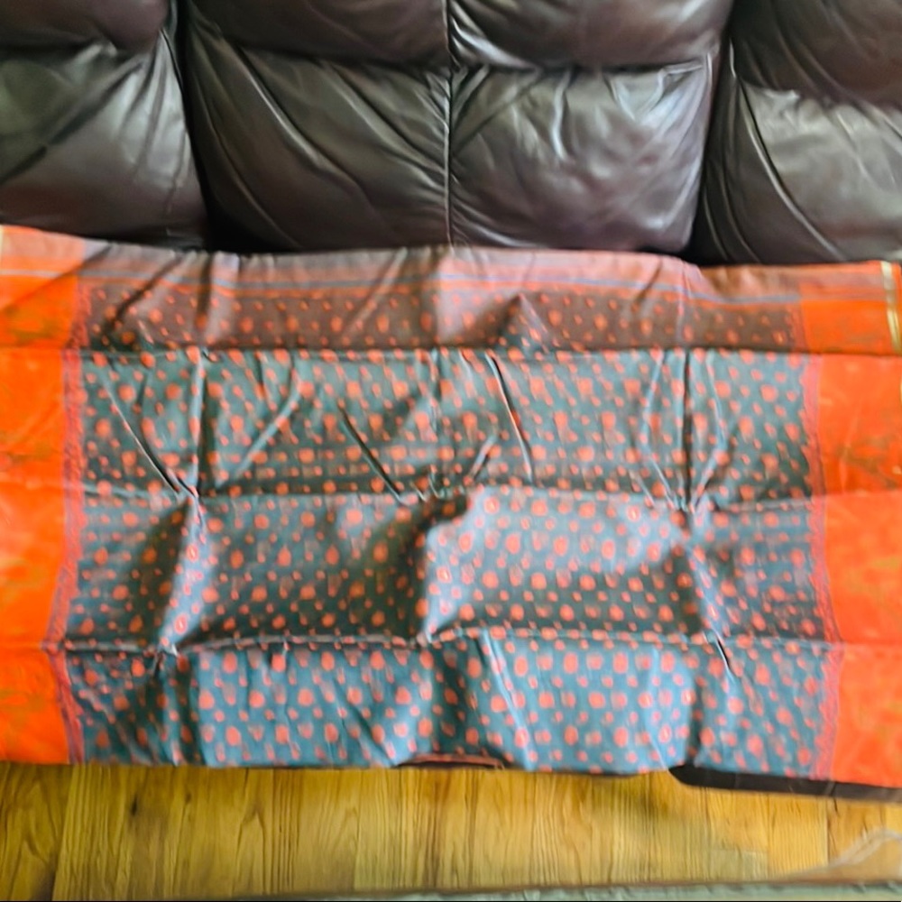 Orange and gray color with dark orange blouse piece. Cotton Jumdani with golden